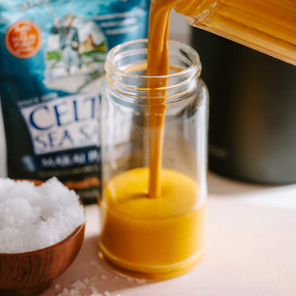 Smoothing being poured into a glass with a sprinkle of Makai Pure Celtic Sea Salt for hydration