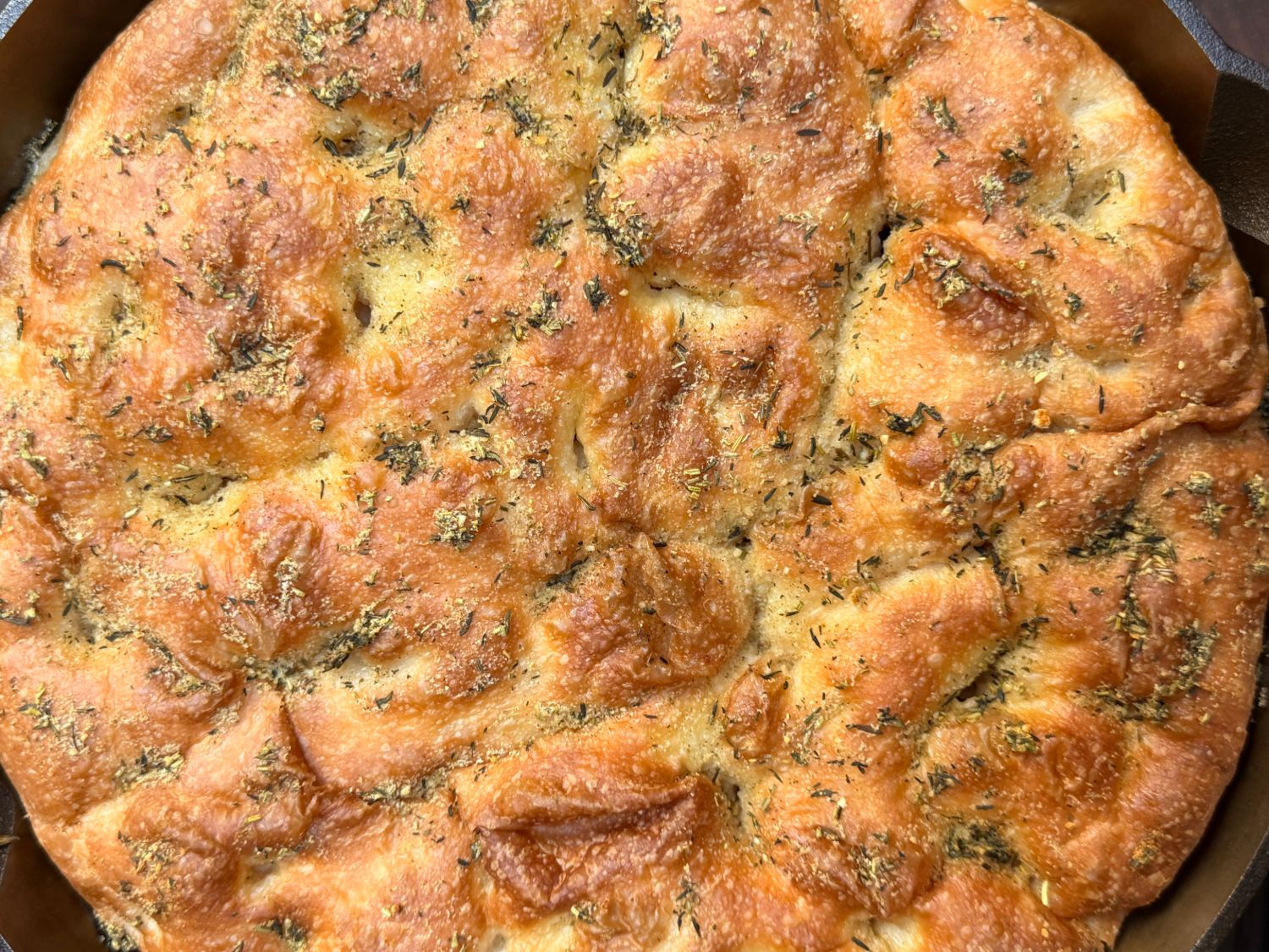 Rustic herb focaccia bread, top-down